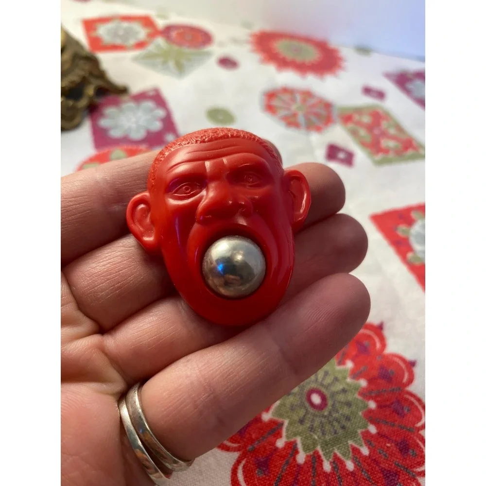 Vintage Red Plastic Monkey Head Novelty Toy with Removable Silver Ball Charm